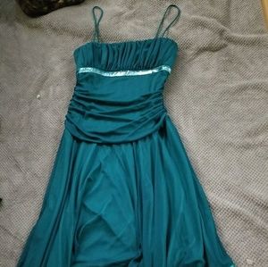 Green asymmetrical dress with sequins